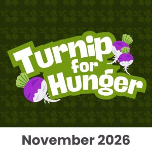 Illustration with the words Turnip for Hunger in bold white letters, two illustrated turnips, and November 2026 at the bottom on a dark green background with a turnip pattern.